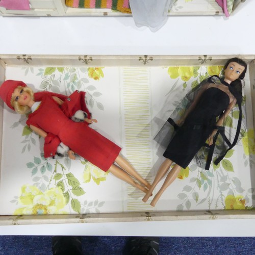 241 - A Barbie doll and a Stacey doll with a selection of outfits,  many with labels including dresses coa... 