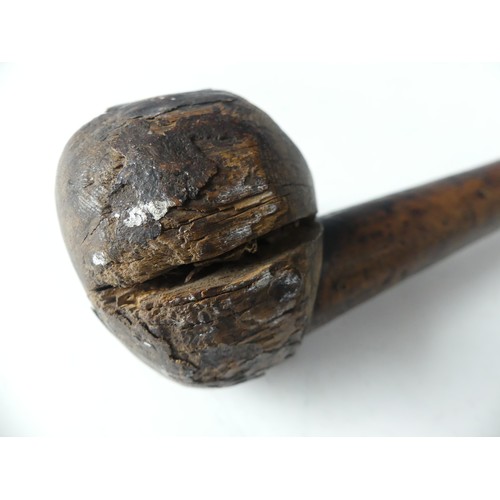 433 - A 19thC Zulu hardwood Knobkerrie, with plain globular head on a cylindrical tapering haft 64cm long,... 