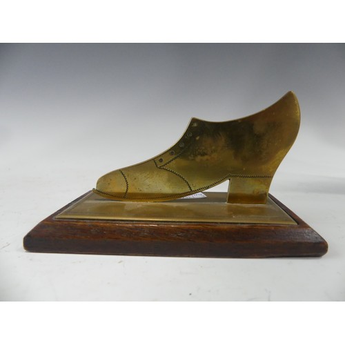 439 - Two Trench art vases, together with a trench art bullet lighter and a mounted trench art shoe (4)... 