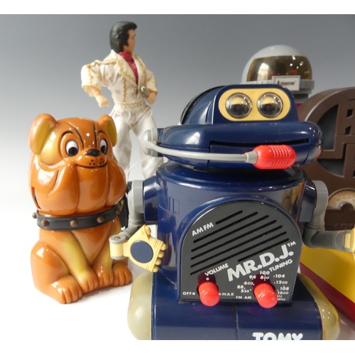 244 - A collection of Novelty radios, including two Mr DJ Tomy robot radios, a steepletone robot radio an ... 