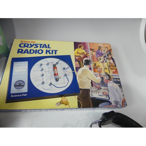 245 - A large collection of Novelty radios, including headphone radios, a crossword radio toilet roll hold... 