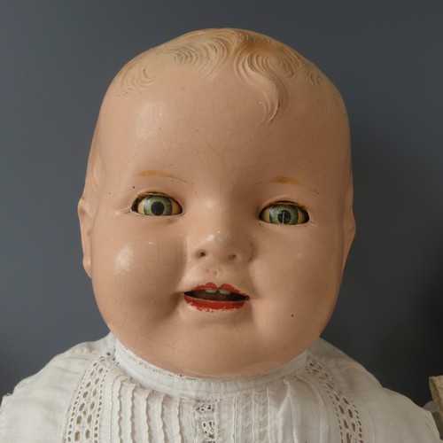 250 - A 1920's composition and cloth Baby Boy doll, cloth body contains crier, sleeping eyes and open mout... 