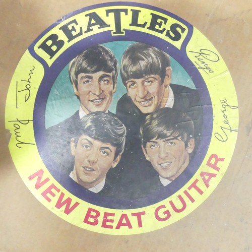 323 - The Beatles - A vintage 1960s Selcol The Beatles ' New Beat ' acoustic model guitar. Burgundy, red a... 