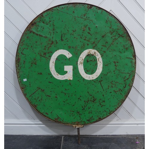 329 - An original vintage 20th century ' Stop / Go ' metal roadside industrial sign, circular form, with r... 