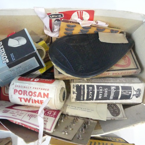 335 - A large collection of vintage shoe repair/cobblers items, including Phillips rubber heels and soles,... 