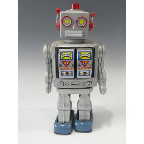 260 - Four Vintage Boxed Robots, including a tinplate battery operated Space Walk Man ME 100, a boxed tinp... 