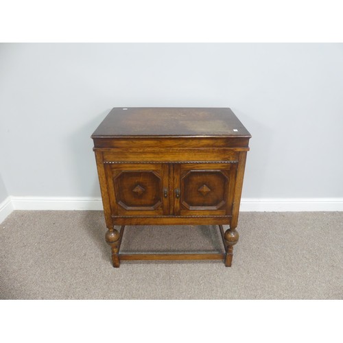 571 - An early 20thC oak cased Selecta Gramophone, having a lift-up lid, record storage and door opening t... 