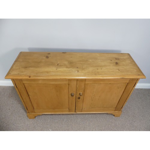 574 - A vintage pine Dresser Base, with double cupboard doors opening to reveal a single shelf, on bracket... 