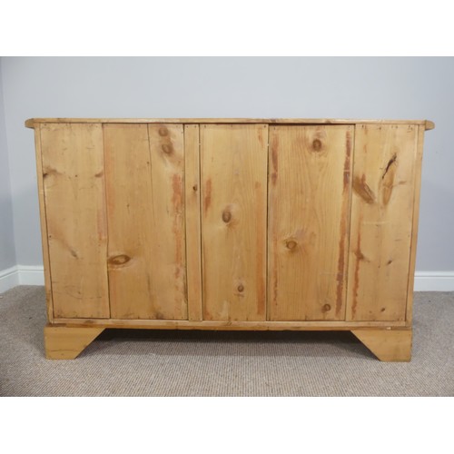 574 - A vintage pine Dresser Base, with double cupboard doors opening to reveal a single shelf, on bracket... 