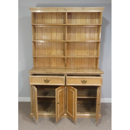 576 - An antique pine farmhouse kitchen Dresser, with moulded cornice above a three tier plate rack, with ... 