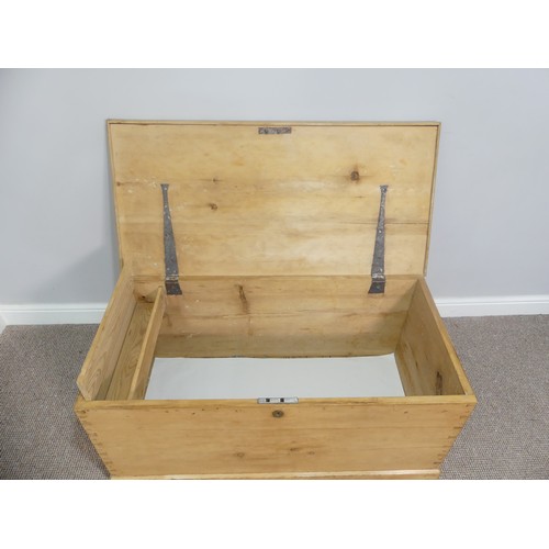 579 - A pine Chest/Blanket Box, with lift-up lid and iron side handles, W 107cm x D 53cm x H 50cm.... 