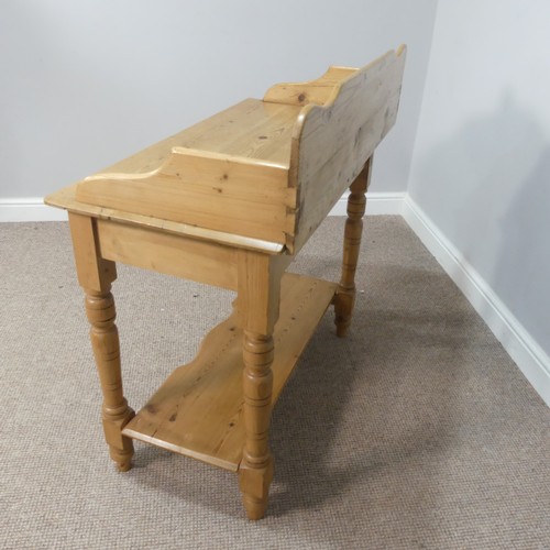 594 - An early 20thC pine Wash Stand, with gallery back above a single frieze drawer and undertier, raised... 