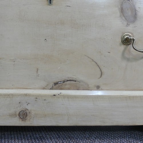 597 - A vintage pine Dressing Table, with mirror above a central drawer, on a base with three further draw... 