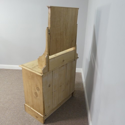 597 - A vintage pine Dressing Table, with mirror above a central drawer, on a base with three further draw... 