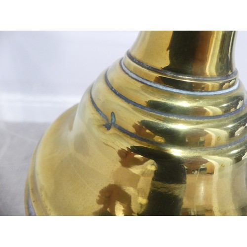 601 - A brass and frosted glass Oil Lamp, the shade with motifs, together with two others similar, tallest... 