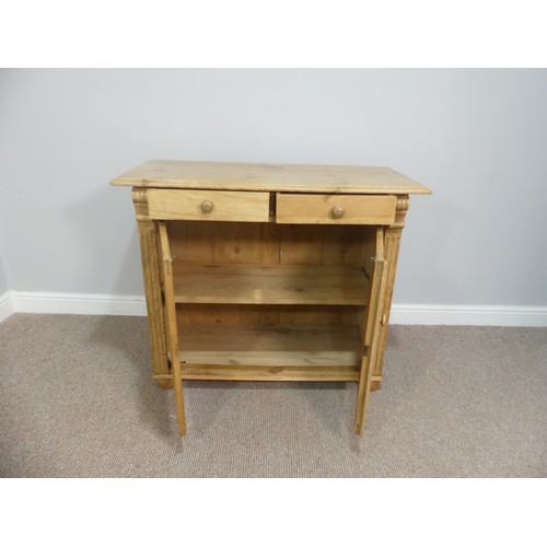 603 - A vintage pine Cupboard, with two frieze drawers above a cupboard with shelved interior, W 103cm x D... 