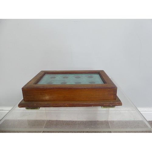 604 - An Ames and Willmer Chichester servants Call Box / Bell Board, having a mahogany case and glazed fro... 