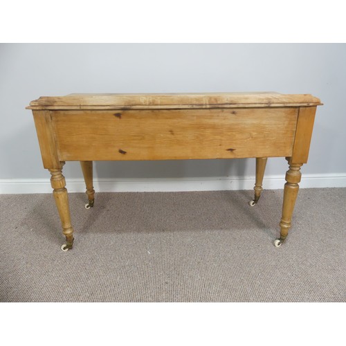 605 - An early 20thC pine Wash Stand, with gallery back, above one long and four short drawers all with ce... 