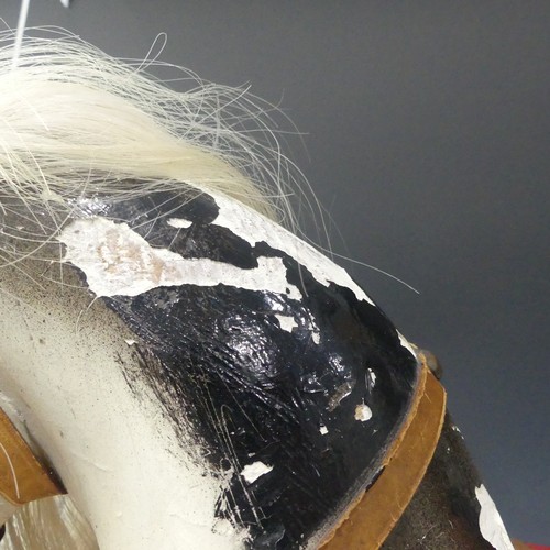 340 - A c.1920's Rocking Horse, finished in grey with white horse hair tail and mane, leather saddle and r... 