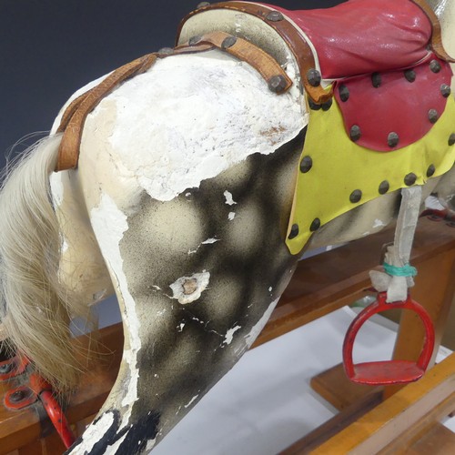 340 - A c.1920's Rocking Horse, finished in grey with white horse hair tail and mane, leather saddle and r... 