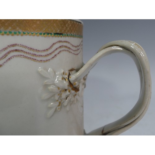 503 - A Chinese export porcelain Armorial Tankard, with double strap handle, decorated with a gilt border,... 