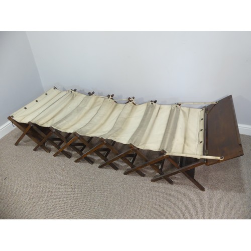 614 - An early 20thC oak-framed concertina camp bed, W 70cm x H 49cm x L 200cm