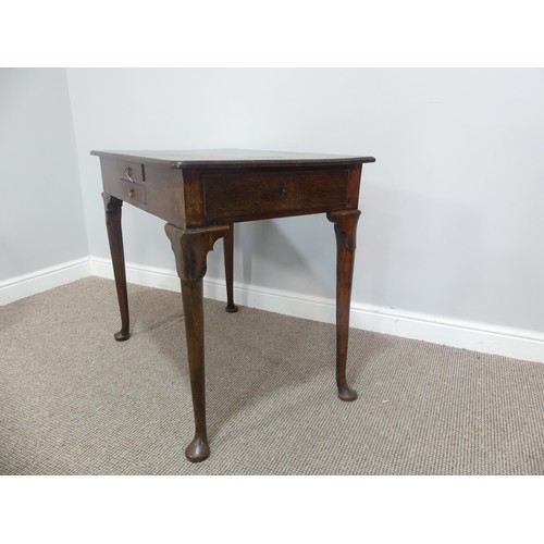 615 - A Georgian oak Side Table, the rectangular top above two drawers to the front and a further drawer t... 