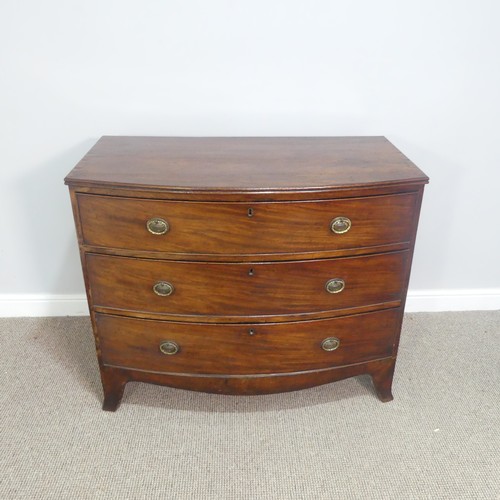 621 - A Georgian mahogany bow front Chest of three long Drawers, raised on bracket feet, W 103cm x H 87cm ... 