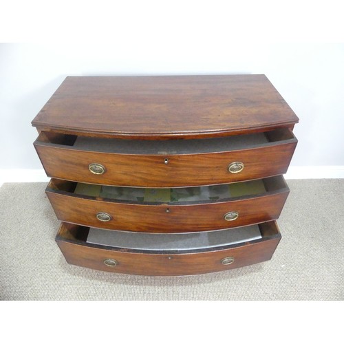 621 - A Georgian mahogany bow front Chest of three long Drawers, raised on bracket feet, W 103cm x H 87cm ... 