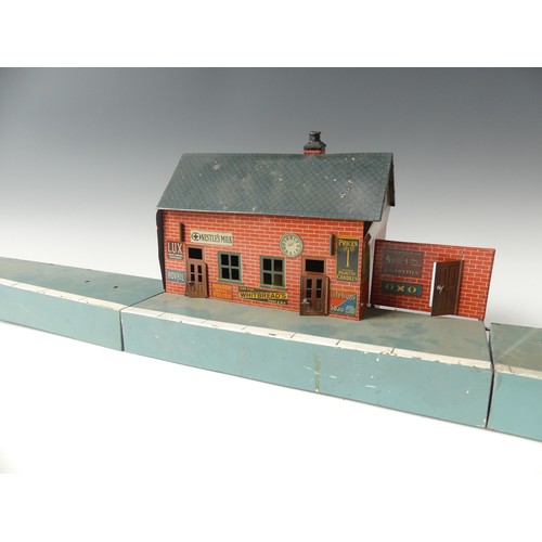 296 - A vintage Bing printed tinplate Station building and platform, incomplete, 124cm long, together with... 