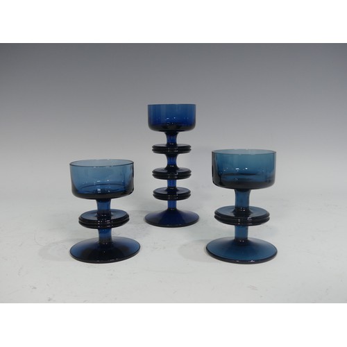 513 - A pair of Wedgwood Sheringham pattern blue glass Candle Holders, designed by Ronald Stennett Wilson,... 