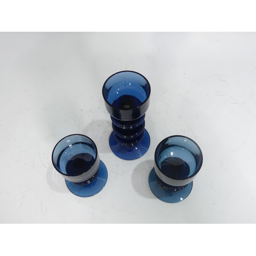 513 - A pair of Wedgwood Sheringham pattern blue glass Candle Holders, designed by Ronald Stennett Wilson,... 