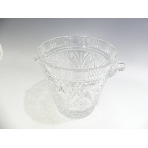 516 - A cut lead crystal glass Champagne Bucket, having shaped twin handles with star cut, hobnail and fac... 