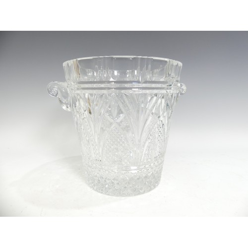 516 - A cut lead crystal glass Champagne Bucket, having shaped twin handles with star cut, hobnail and fac... 