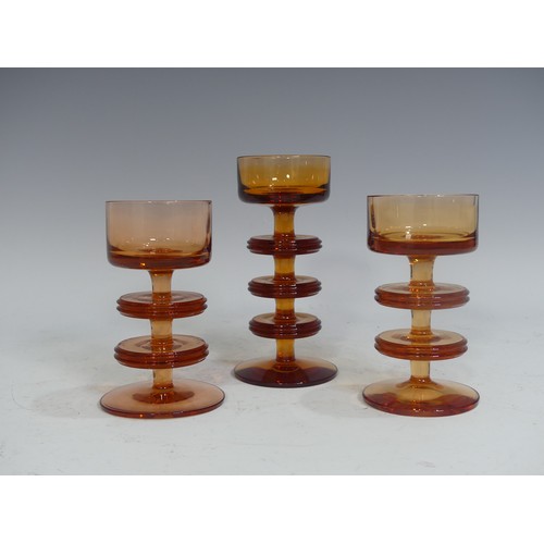 517 - A pair of Wedgwood Sheringham pattern amber glass Candle Holders, designed by Ronald Stennett Wilson... 