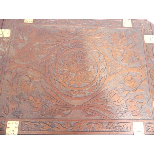 624 - An Arts and Crafts carved oak Butlers Tray, with all over floral motifs, 85cm x 69cm.... 