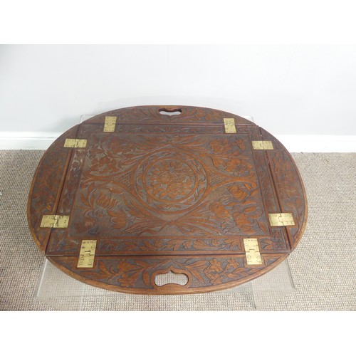 624 - An Arts and Crafts carved oak Butlers Tray, with all over floral motifs, 85cm x 69cm.... 