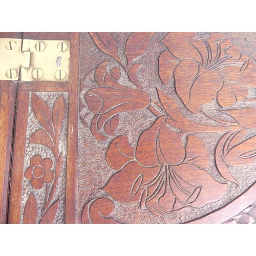 624 - An Arts and Crafts carved oak Butlers Tray, with all over floral motifs, 85cm x 69cm.... 