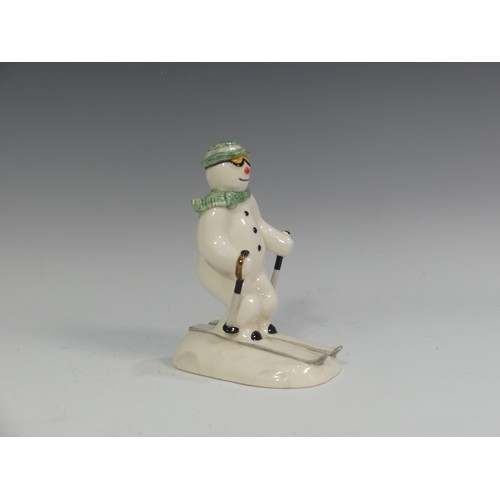 524 - A Royal Doulton figure of The Snowman Skiing, DS21, from The Snowman Gift Collection, H 14cm.... 