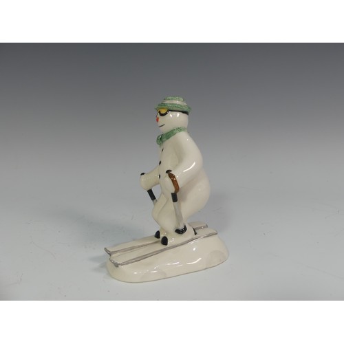 524 - A Royal Doulton figure of The Snowman Skiing, DS21, from The Snowman Gift Collection, H 14cm.... 