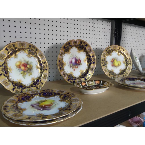 531 - An early 20thC Royal Worcester part Dessert Service, each piece decorated with fruit and set within ... 