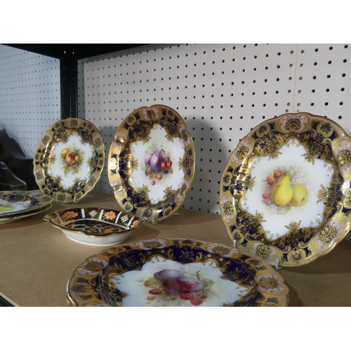 531 - An early 20thC Royal Worcester part Dessert Service, each piece decorated with fruit and set within ... 