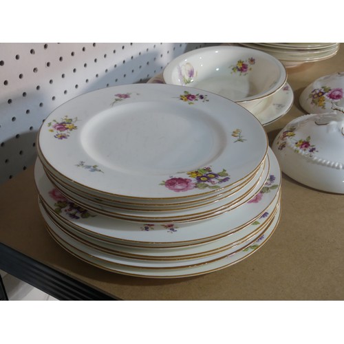 533 - A Royal Worcester part Dinner Service, decorated with floral swags, comprising Platter, Serving Dish... 