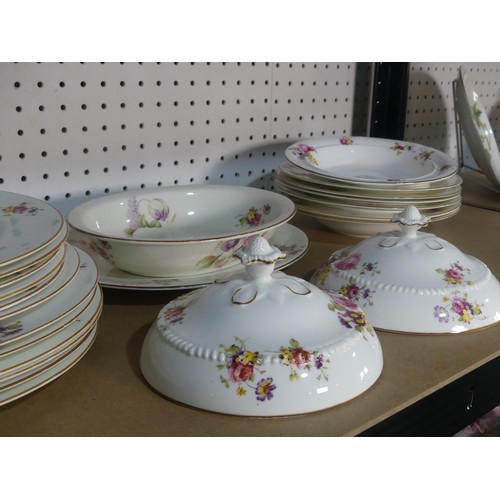 533 - A Royal Worcester part Dinner Service, decorated with floral swags, comprising Platter, Serving Dish... 