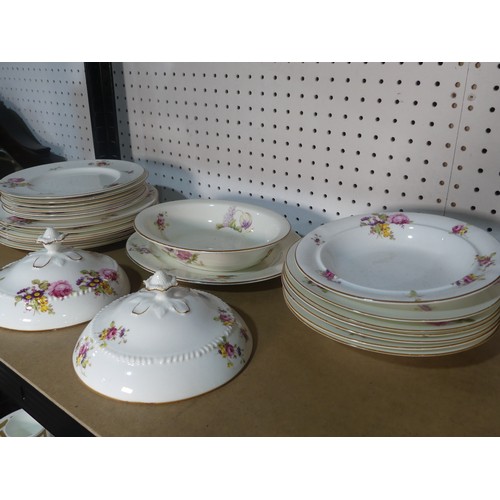 533 - A Royal Worcester part Dinner Service, decorated with floral swags, comprising Platter, Serving Dish... 