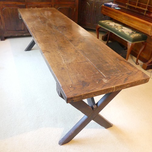 657 - A Georgian oak Refectory Table, the rectangular top above stile feet joined by a stretcher, stretche... 