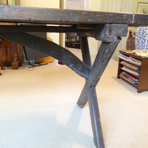 657 - A Georgian oak Refectory Table, the rectangular top above stile feet joined by a stretcher, stretche... 