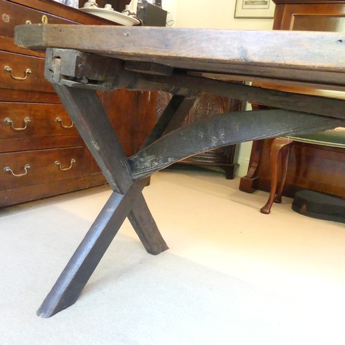 657 - A Georgian oak Refectory Table, the rectangular top above stile feet joined by a stretcher, stretche... 