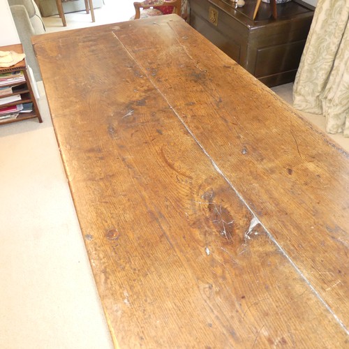 657 - A Georgian oak Refectory Table, the rectangular top above stile feet joined by a stretcher, stretche... 