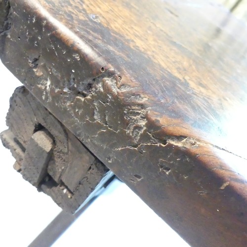 657 - A Georgian oak Refectory Table, the rectangular top above stile feet joined by a stretcher, stretche... 